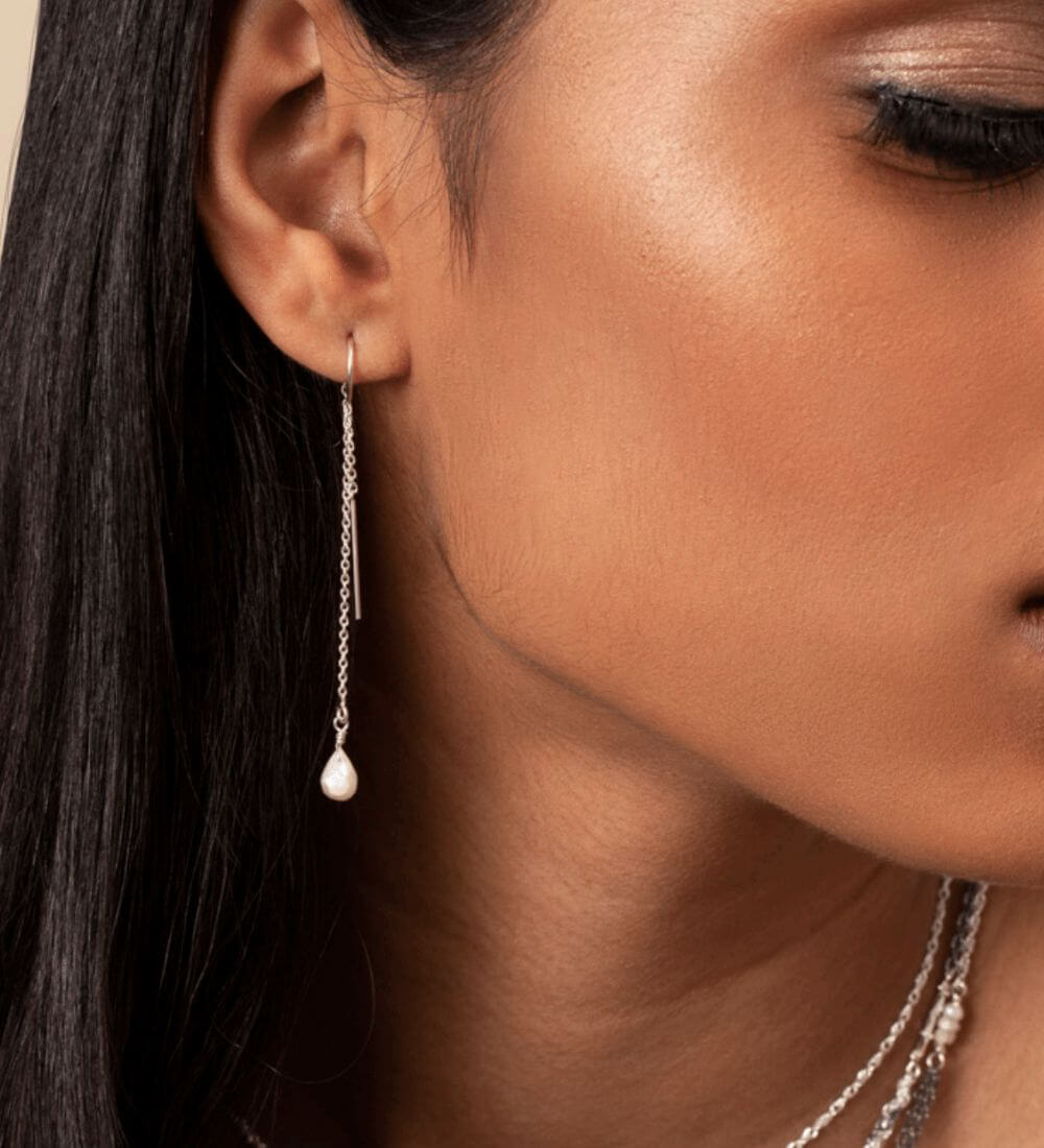 A woman wearing contemporary earrings from Kate Winternitz Jewelry