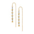 A pair of gold dangle earrings with floral motifs, featuring yellow-gold flower charms, dark metallic spacer rings, and a fine gold chain leading to a long straight drop.