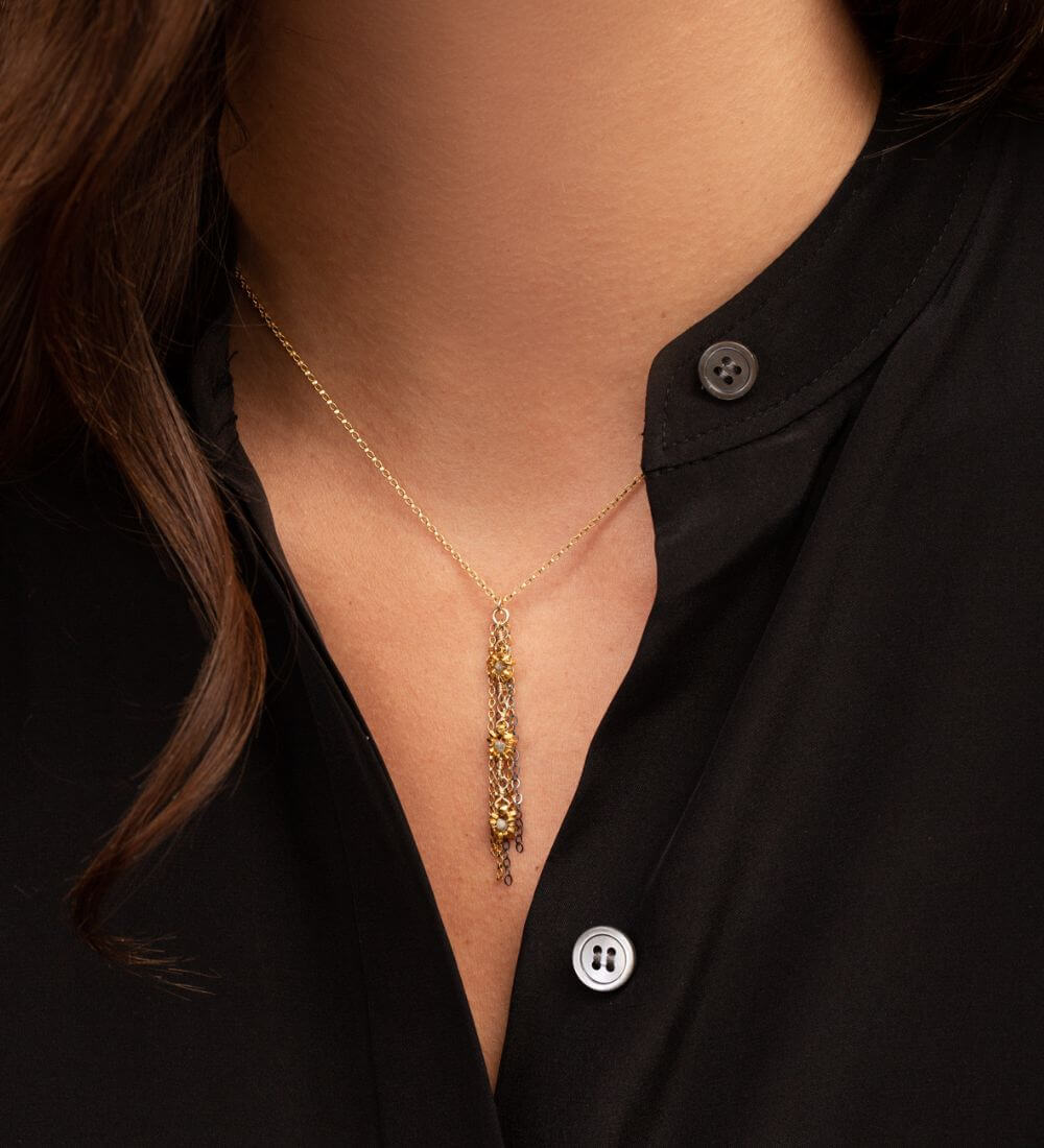 A modern working woman wearing everyday necklace from Kate Winternitz