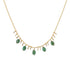 A gold-colored emerald necklace with multiple emerald pendants and gold accents.