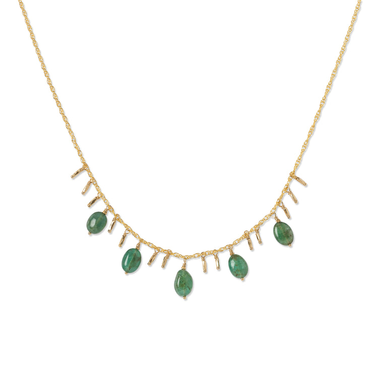 A gold-colored emerald necklace with multiple emerald pendants and gold accents.