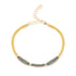 A mixed metal bracelet with a patterned chain of 14K gold-fill and oxidized sterling silver, displayed on a white background.