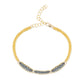 A mixed metal bracelet with a patterned chain of 14K gold-fill and oxidized sterling silver, displayed on a white background.