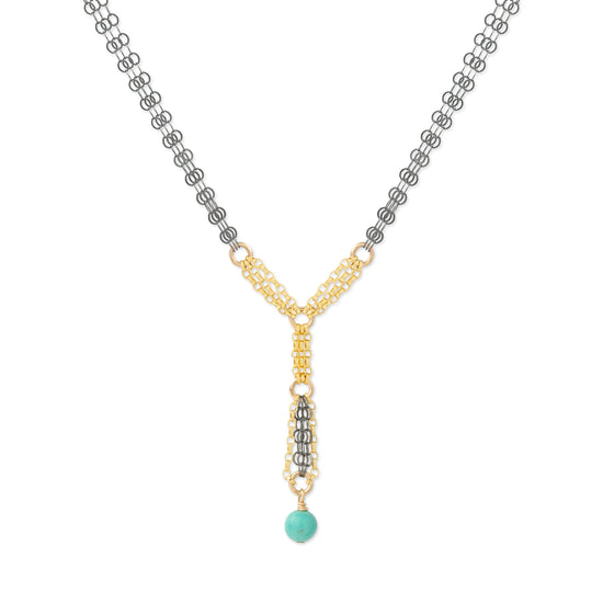 A Y-shaped necklace featuring a gold and silver chain design with a turquoise bead pendant, shown on a plain white background.