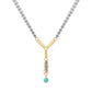 A Y-shaped necklace featuring a gold and silver chain design with a turquoise bead pendant, shown on a plain white background.