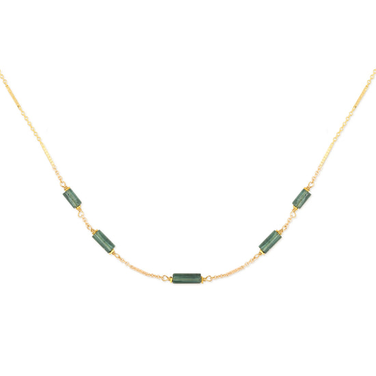 Necklace with teal tourmaline beads on a gold chain against a white background