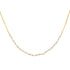 Gold necklace with small pearls on a white background