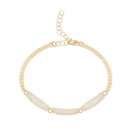A mixed metal bracelet with a patterned chain of 14K gold-fill and sterling silver, shown in a laid-out configuration against a white background.