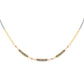 Mixed metal necklace with natural faceted garnets on a white background