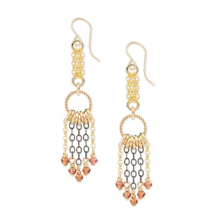 Gold and silver chain earrings with small red garnet beads on a white background