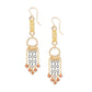 Gold and silver chain earrings with small red garnet beads on a white background