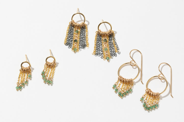 Three pairs of circle fringe earrings with emerald bead accents 