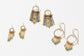 Three pairs of circle fringe earrings with emerald bead accents 