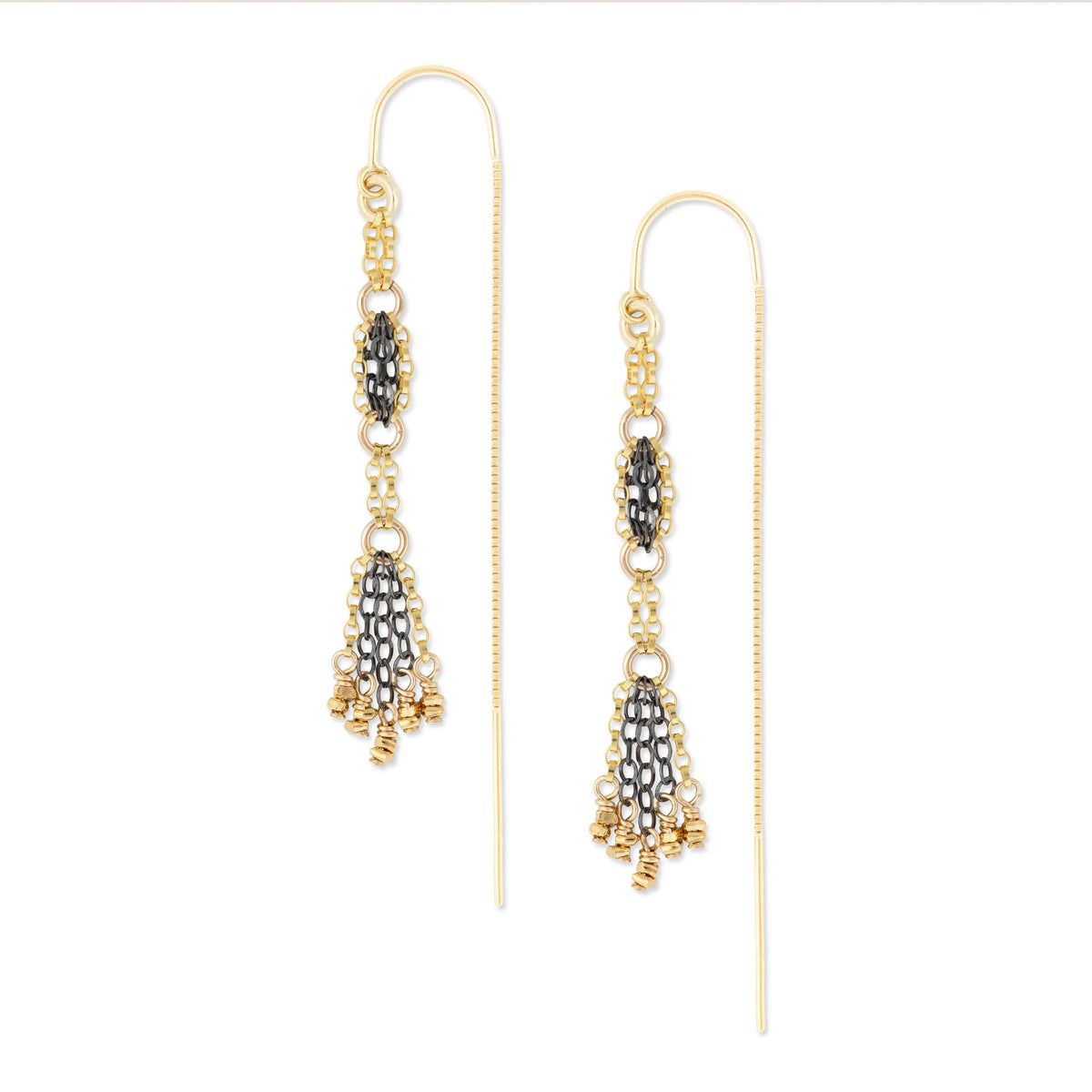 Gold and oxidized silver beaded earrings on a white background