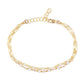 Gold chain bracelet with pearl accents on a white background