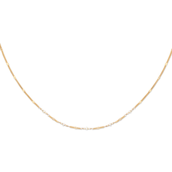 A gold-colored necklace with a patterned chain and small pearls