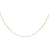 A gold-colored necklace with a patterned chain and small pearls