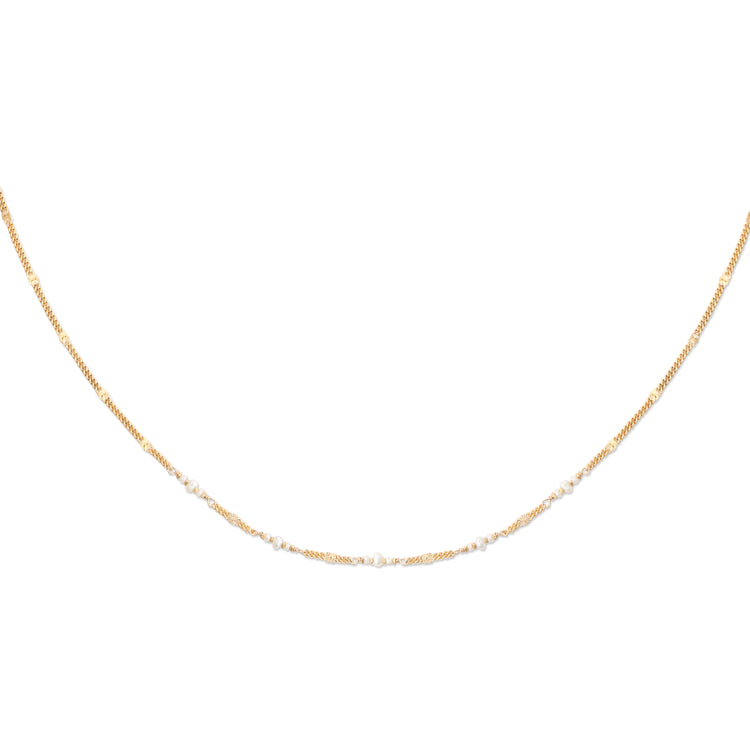 A gold-colored necklace with a patterned chain and small pearls