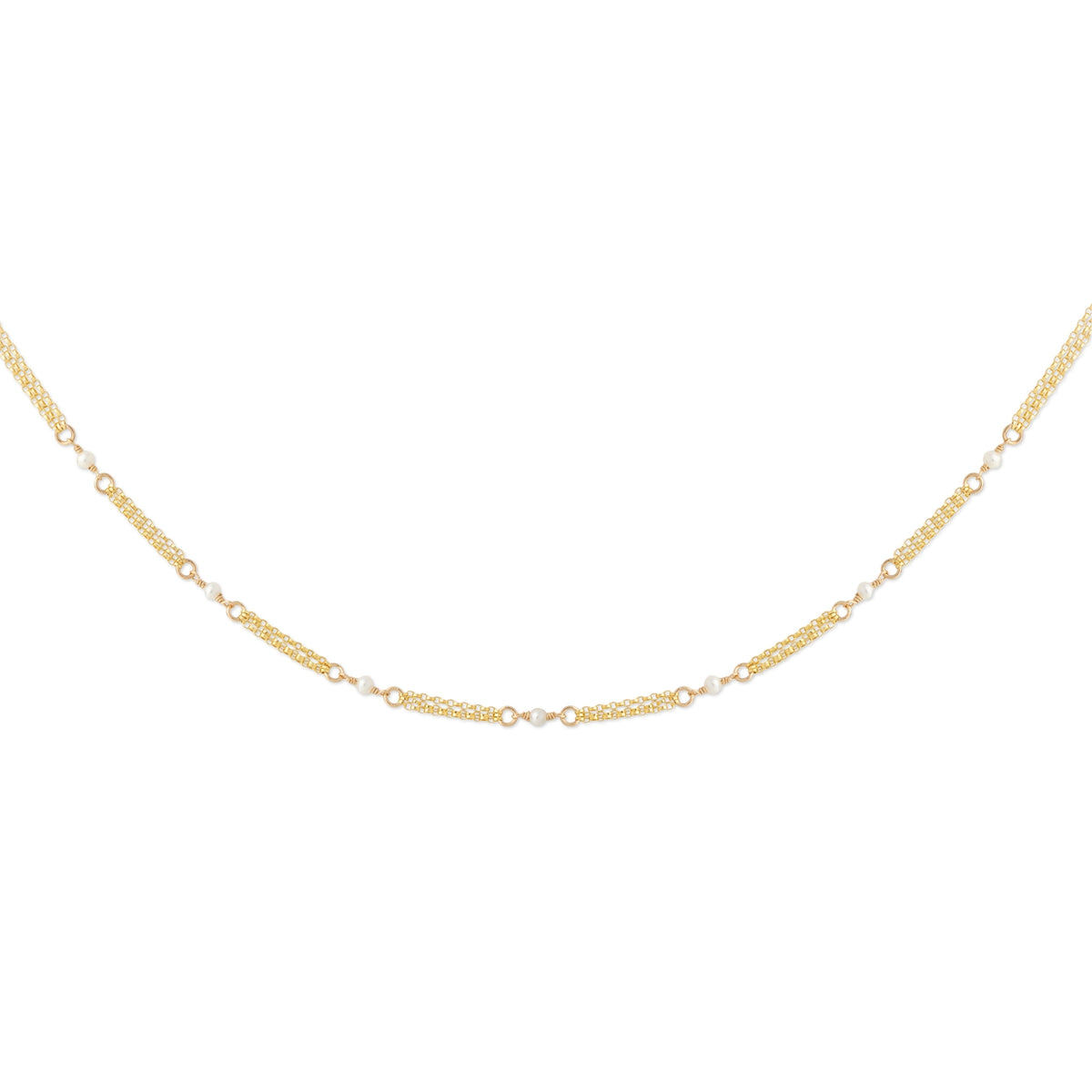 A delicate gold chain necklace with alternating textured oval links and small round clear stones, displayed in a curved shape against a plain white background.