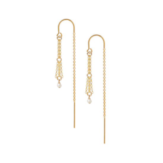 A pair of gold drop earrings with delicate chain drapes and small white pearl accents, shown against a plain white background.