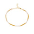 A delicate gold chain anklet featuring alternating small white pearl beads and textured gold spacer links, displayed on a clean white background.