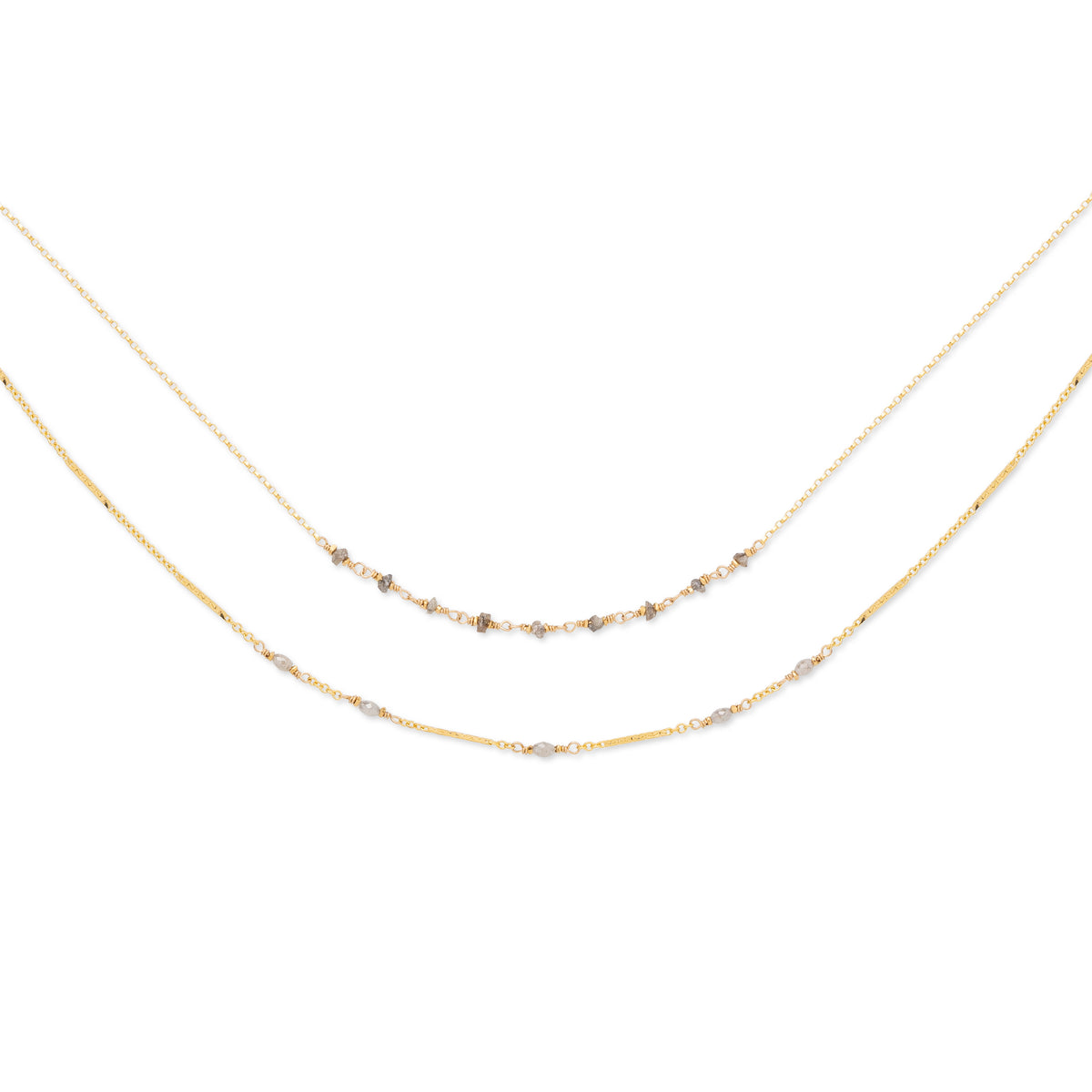 A double-stranded necklace with faceted gray diamonds set on two chains, with a 14K gold fill. The shorter chain is 16 inches, and the longer chain includes an 18-inch base with an additional 2-inch extender.