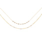 A double-stranded necklace with faceted gray diamonds set on two chains, with a 14K gold fill. The shorter chain is 16 inches, and the longer chain includes an 18-inch base with an additional 2-inch extender.