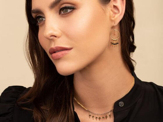 A modern woman wearing feminine and classic jewelry from Kate Winternitz Jewelry