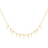 Gold necklace with teardrop-shaped pearls on a white background