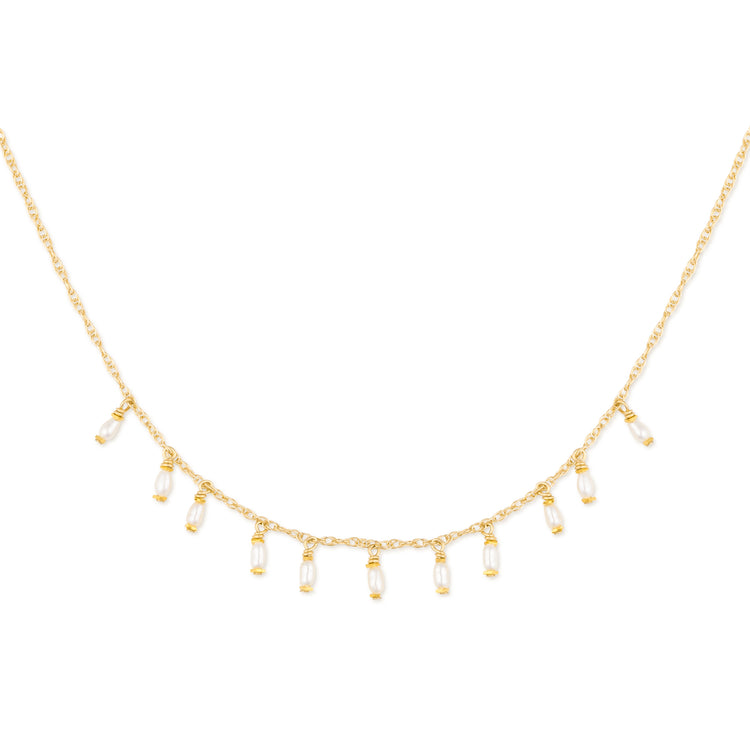 Gold necklace with teardrop-shaped pearls on a white background
