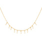 Gold necklace with teardrop-shaped pearls on a white background