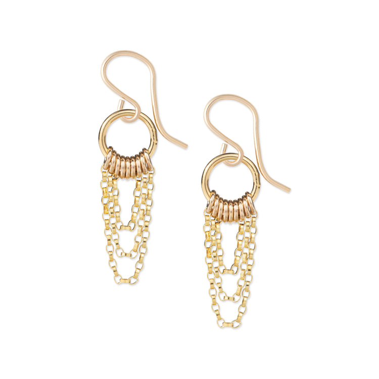 Gold chain earrings on a white background