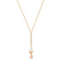 A gold-filled necklace with a sterling silver chain and a sunstone drop accented with smaller sunstone gemstones.