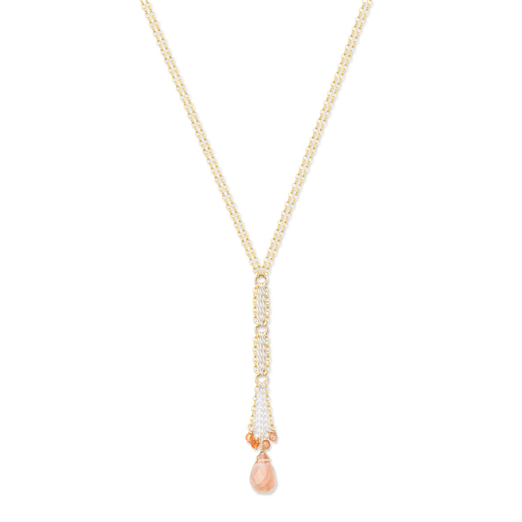 A gold-filled necklace with a sterling silver chain and a sunstone drop accented with smaller sunstone gemstones.