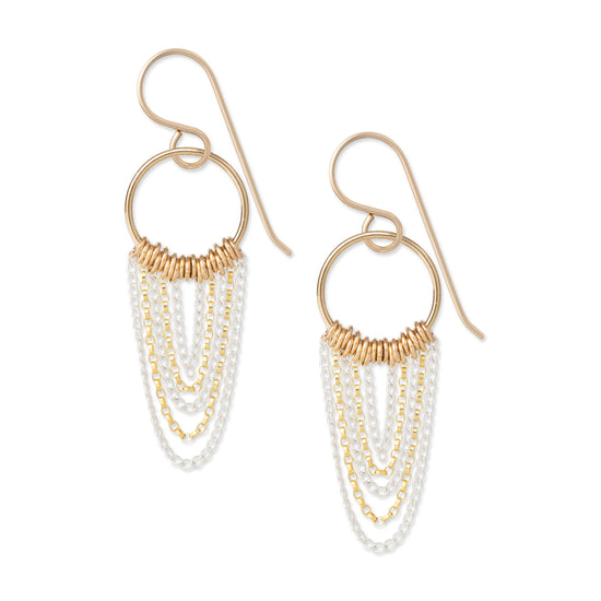 A pair of earrings featuring draped gold-fill and sterling silver chains on a white background 