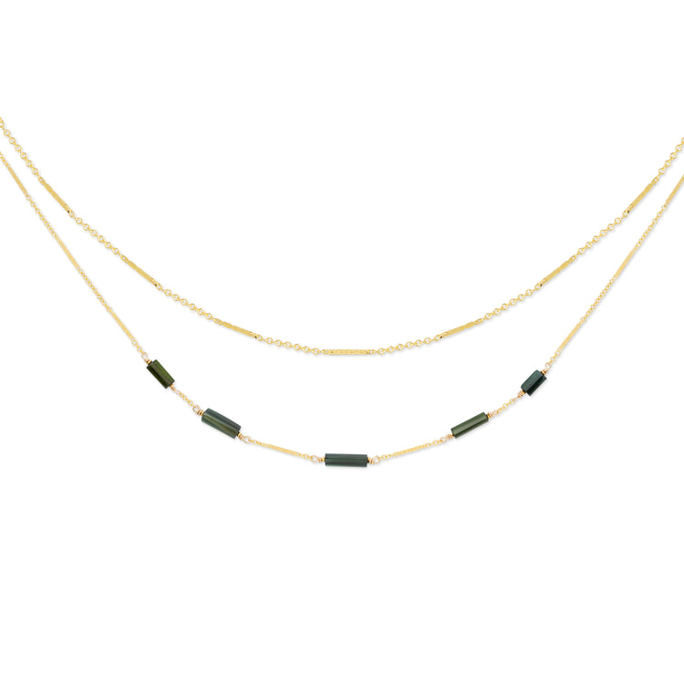 Linda double-stranded gold necklace with a bar and link chain, accented with green tourmaline stones, shown on a white background.