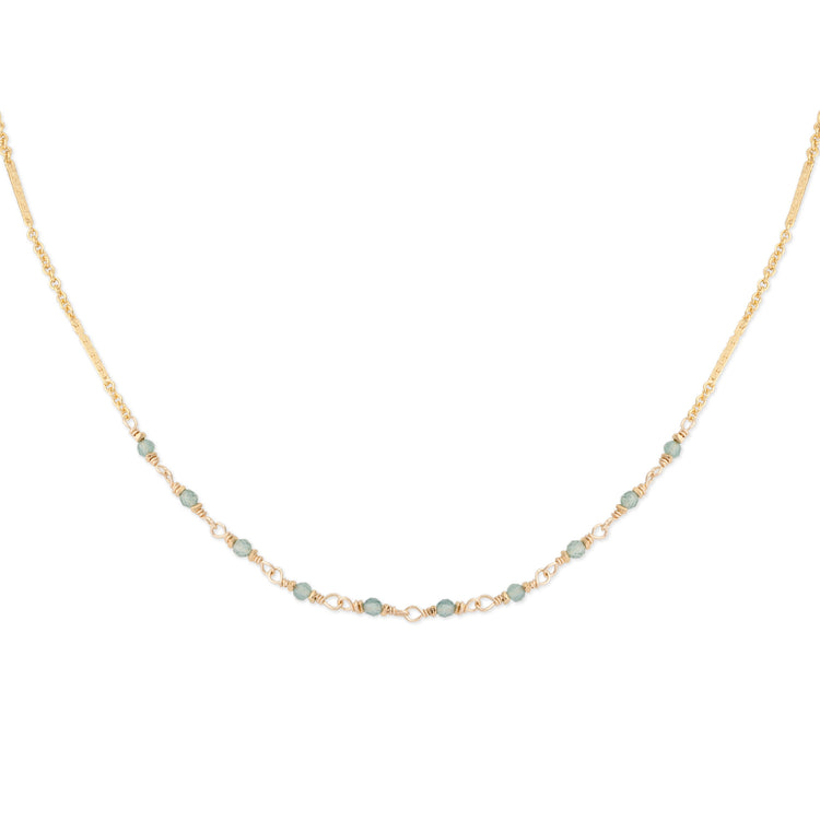 The Alexis Blue 16-inch 14K gold-fill bar and link chain necklace featuring faceted blue tourmaline gemstones and a 2-inch extender, shown on a white background.