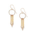 Intricately patterned gold chain fringe earrings embellished with faceted white sapphire gemstones, shown on a white background.